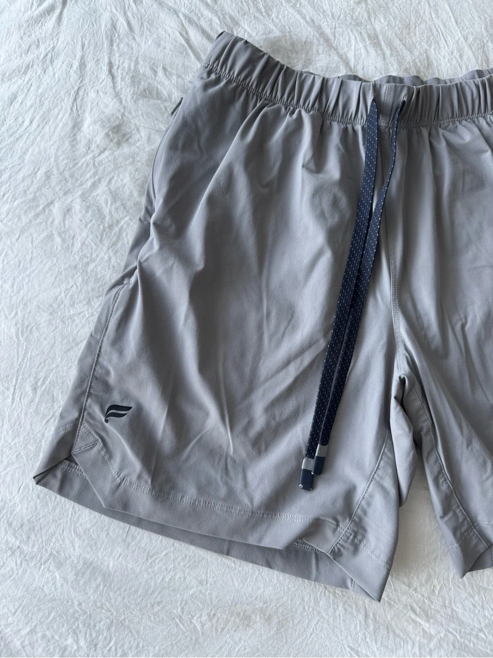 Fabletics Men's Light Gray Athletic Shorts with Navy Drawstring